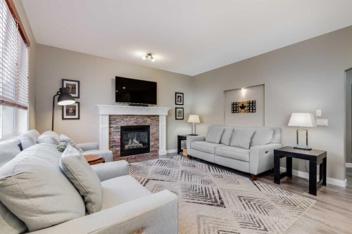 407 Morningside Crescent Sw, Airdrie, AB - Indoor Photo Showing Living Room With Fireplace