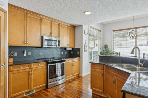 160 Sunset Close, Cochrane, AB - Indoor Photo Showing Kitchen With Stainless Steel Kitchen With Double Sink