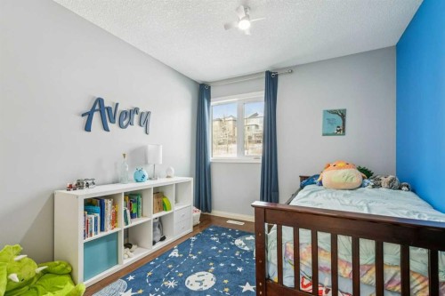160 Sunset Close, Cochrane, AB - Indoor Photo Showing Bedroom