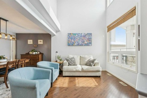 160 Sunset Close, Cochrane, AB - Indoor Photo Showing Living Room