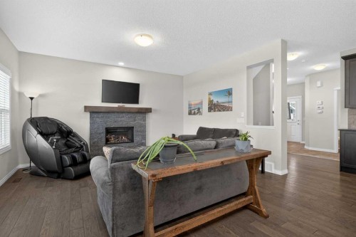 20 Mount Rae Terrace, Okotoks, AB - Indoor Photo Showing Living Room With Fireplace