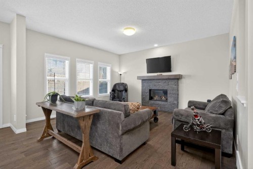 20 Mount Rae Terrace, Okotoks, AB - Indoor Photo Showing Living Room With Fireplace