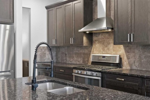 20 Mount Rae Terrace, Okotoks, AB - Indoor Photo Showing Kitchen With Double Sink With Upgraded Kitchen