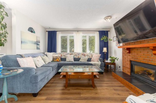 23 Whitlock Close Ne, Calgary, AB - Indoor Photo Showing Living Room With Fireplace