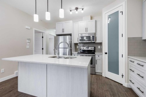 1511-2461 Baysprings Link Sw, Airdrie, AB - Indoor Photo Showing Kitchen With Stainless Steel Kitchen With Double Sink With Upgraded Kitchen