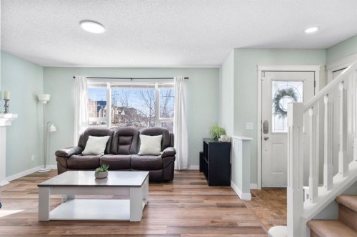 327 Copperstone Grove Se, Calgary, AB - Indoor Photo Showing Living Room With Fireplace