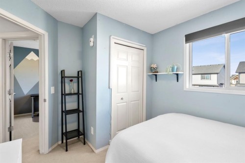 327 Copperstone Grove Se, Calgary, AB - Indoor Photo Showing Bedroom
