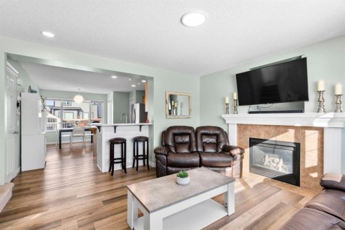 327 Copperstone Grove Se, Calgary, AB - Indoor Photo Showing Living Room With Fireplace