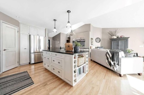 10 Bow Point, Cochrane, AB - Indoor Photo Showing Kitchen With Stainless Steel Kitchen With Upgraded Kitchen
