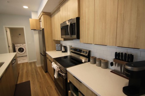 1207-220 Seton Grove Se, Calgary, AB - Indoor Photo Showing Kitchen