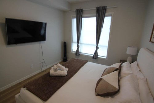 1207-220 Seton Grove Se, Calgary, AB - Indoor Photo Showing Bedroom