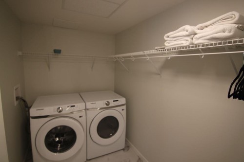 1207-220 Seton Grove Se, Calgary, AB - Indoor Photo Showing Laundry Room