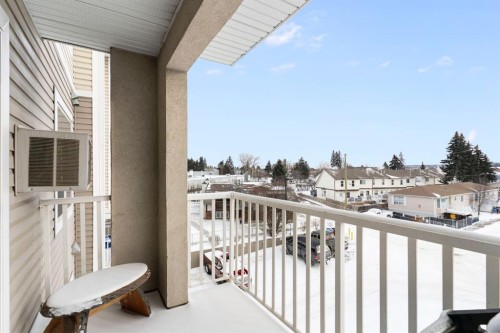 301-128 Centre Avenue, Cochrane, AB - Outdoor With Balcony With Exterior