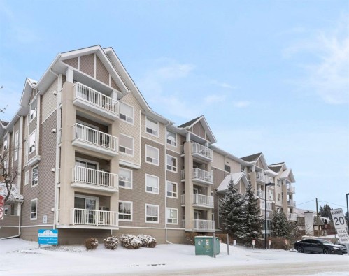 301-128 Centre Avenue, Cochrane, AB - Outdoor With Balcony With Facade