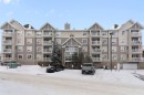 301-128 Centre Avenue, Cochrane, AB  - Outdoor With Balcony With Facade 