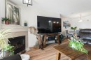 301-128 Centre Avenue, Cochrane, AB  - Indoor Photo Showing Living Room With Fireplace 