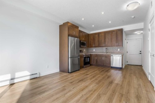 2113-200 Seton Circle Se, Calgary, AB - Indoor Photo Showing Kitchen With Stainless Steel Kitchen