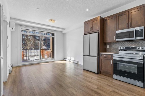 2113-200 Seton Circle Se, Calgary, AB - Indoor Photo Showing Kitchen With Stainless Steel Kitchen
