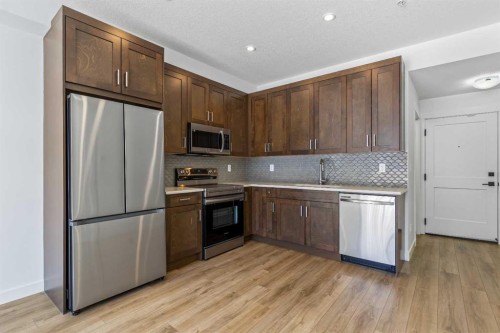 2113-200 Seton Circle Se, Calgary, AB - Indoor Photo Showing Kitchen With Stainless Steel Kitchen