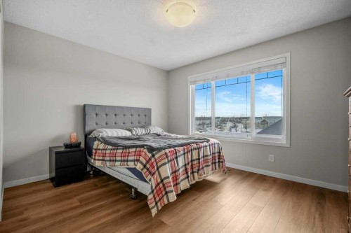 209 New Brighton Walk Se, Calgary, AB - Indoor Photo Showing Bedroom