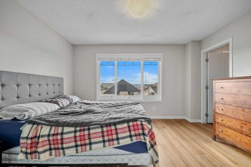 209 New Brighton Walk Se, Calgary, AB - Indoor Photo Showing Bedroom