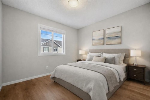 209 New Brighton Walk Se, Calgary, AB - Indoor Photo Showing Bedroom