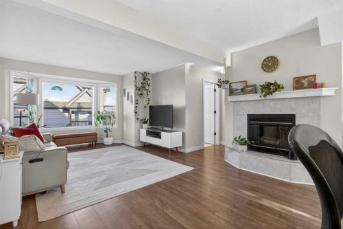41 Sandarac Villas Nw, Calgary, AB - Indoor Photo Showing Living Room With Fireplace