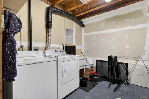 41 Sandarac Villas Nw, Calgary, AB - Indoor Photo Showing Laundry Room