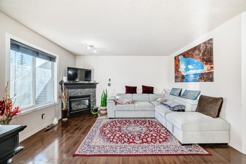 21 Royal Oak Gardens Nw, Calgary, AB - Indoor Photo Showing Living Room With Fireplace