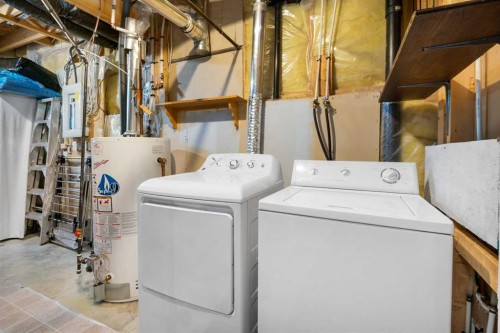 118 Bridleridge Way Sw, Calgary, AB - Indoor Photo Showing Laundry Room