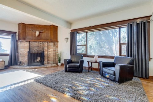 53 Croxford Estates Ne, Airdrie, AB - Indoor Photo Showing Living Room With Fireplace