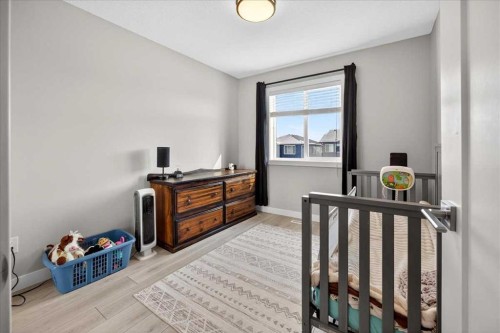 170 Creekside Drive Sw, Calgary, AB - Indoor Photo Showing Bedroom