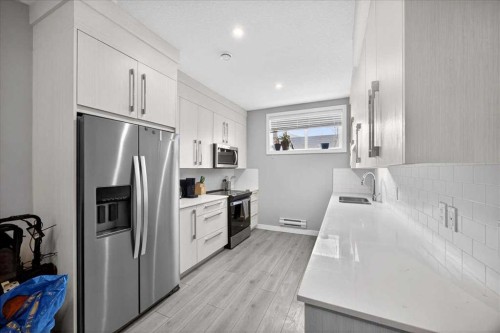 170 Creekside Drive Sw, Calgary, AB - Indoor Photo Showing Kitchen With Upgraded Kitchen