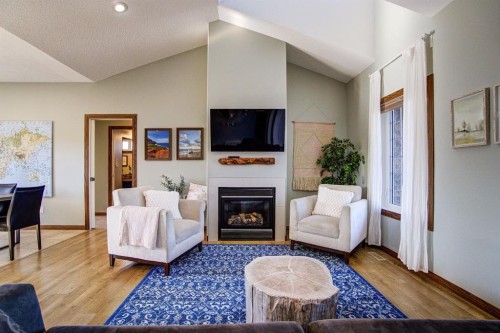 109 Derochie Drive, Claresholm, AB - Indoor Photo Showing Living Room With Fireplace