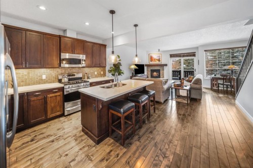 1-105 Rundle Drive, Canmore, AB - Indoor Photo Showing Kitchen With Double Sink With Upgraded Kitchen