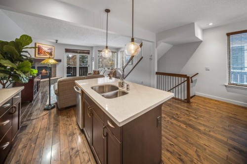 1-105 Rundle Drive, Canmore, AB - Indoor Photo Showing Kitchen With Double Sink