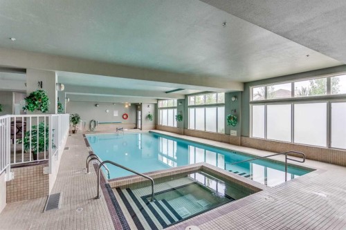 236-15 Everstone Drive Sw, Calgary, AB - Indoor Photo Showing Other Room With In Ground Pool