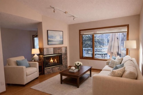 135 Hamptons Park Nw, Calgary, AB - Indoor Photo Showing Living Room With Fireplace