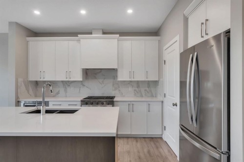 24 Corner Glen Green Ne, Calgary, AB - Indoor Photo Showing Kitchen With Stainless Steel Kitchen With Double Sink With Upgraded Kitchen