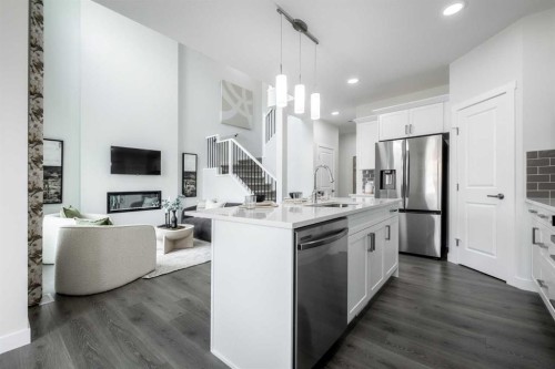 133 Sora Gardens Se, Calgary, AB - Indoor Photo Showing Kitchen With Double Sink With Upgraded Kitchen