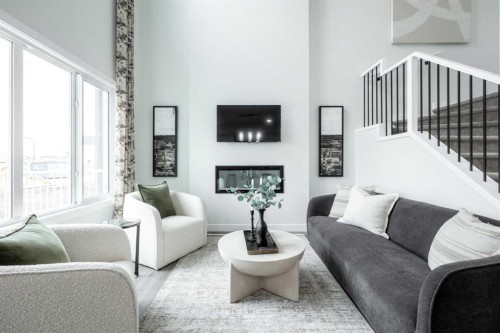 133 Sora Gardens Se, Calgary, AB - Indoor Photo Showing Living Room With Fireplace