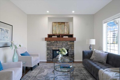 195 Marquis Common Se, Calgary, AB - Indoor Photo Showing Living Room With Fireplace