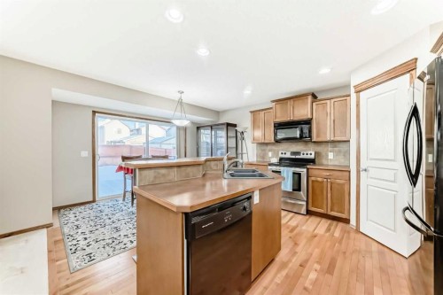834 Cranston Drive Se, Calgary, AB - Indoor Photo Showing Kitchen With Double Sink
