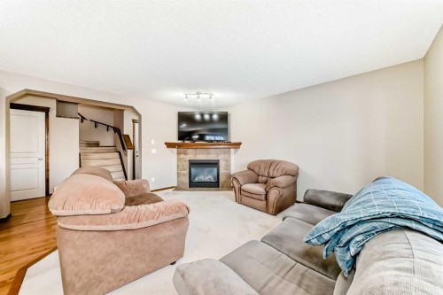 834 Cranston Drive Se, Calgary, AB - Indoor Photo Showing Living Room With Fireplace