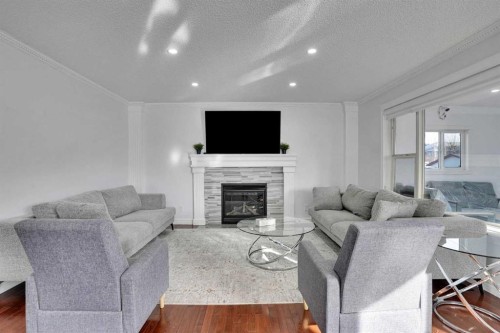 148 Martha'S Manor Ne, Calgary, AB - Indoor Photo Showing Living Room With Fireplace
