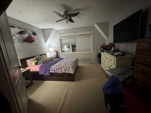 2105 New Brighton Gardens Se, Calgary, AB - Indoor Photo Showing Bedroom