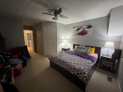 2105 New Brighton Gardens Se, Calgary, AB - Indoor Photo Showing Bedroom