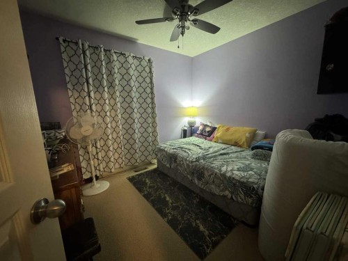 2105 New Brighton Gardens Se, Calgary, AB - Indoor Photo Showing Bedroom