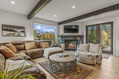 628 Silvertip Road, Canmore, AB - Indoor Photo Showing Living Room With Fireplace