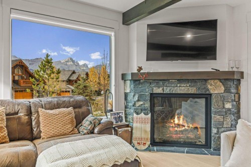 628 Silvertip Road, Canmore, AB - Indoor Photo Showing Living Room With Fireplace